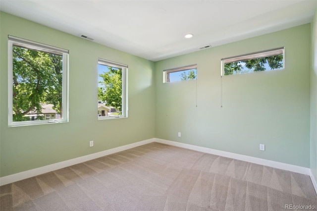 2377 S Humboldt St, Denver, CO 80210 - carpeted empty room featuring baseboards and recessed lighting