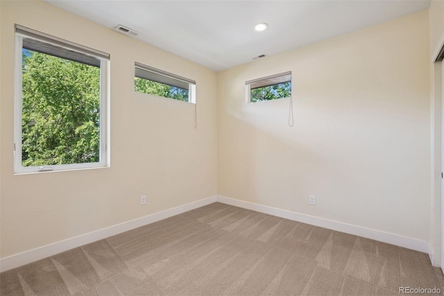 2377 S Humboldt St, Denver, CO 80210 - spare room with light colored carpet and recessed lighting