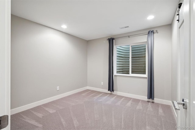 2377 S Humboldt St, Denver, CO 80210 - unfurnished room with light colored carpet and recessed lighting