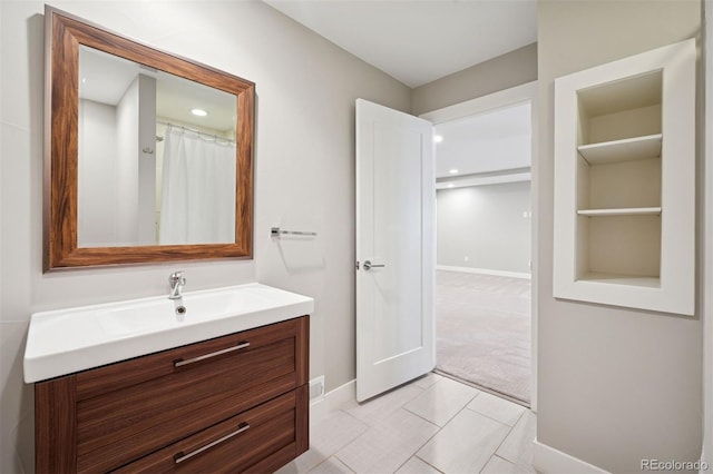 2377 S Humboldt St, Denver, CO 80210 - full bathroom featuring vanity and recessed lighting