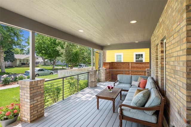 2377 S Humboldt St, Denver, CO 80210 - wooden porch with an outdoor hangout area