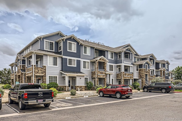 5255 Memphis St Unit 224, Denver, CO 80239 - multi unit property with uncovered parking and stone siding