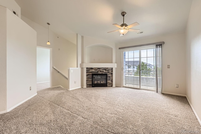 5255 Memphis St Unit 224, Denver, CO 80239 - unfurnished living room with carpet flooring, a ceiling fan, baseboards, and a fireplace