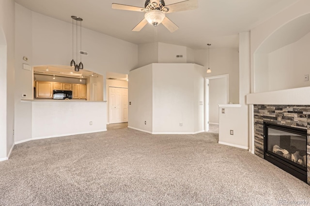 5255 Memphis St Unit 224, Denver, CO 80239 - unfurnished living room with carpet floors, ceiling fan, high vaulted ceiling, and baseboards