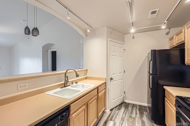 5255 Memphis St Unit 224, Denver, CO 80239 - kitchen with light brown cabinets, a sink, rail lighting, and light wood-style flooring