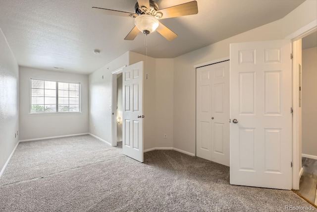 5255 Memphis St Unit 224, Denver, CO 80239 - unfurnished bedroom featuring carpet, a closet, baseboards, and a ceiling fan