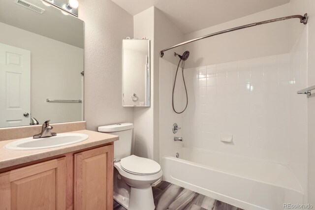 5255 Memphis St Unit 224, Denver, CO 80239 - bathroom with toilet, tub / shower combination, and vanity