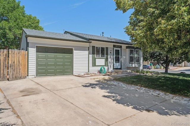 20714 E Buchanan Dr, Aurora, CO 80011 - single story home with concrete driveway and a garage