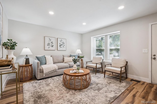 20714 E Buchanan Dr, Aurora, CO 80011 - living area featuring wood finished floors and recessed lighting
