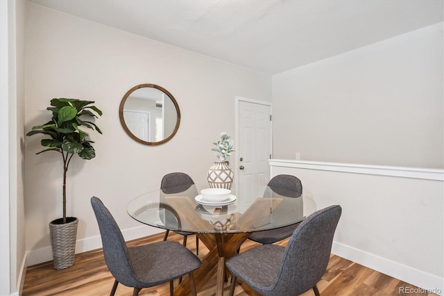 20714 E Buchanan Dr, Aurora, CO 80011 - dining room featuring baseboards and wood finished floors