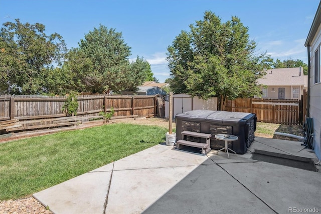 20714 E Buchanan Dr, Aurora, CO 80011 - fenced backyard with a patio, a hot tub, and a storage shed