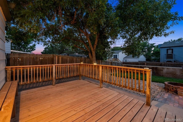 20714 E Buchanan Dr, Aurora, CO 80011 - deck at dusk with a fenced backyard