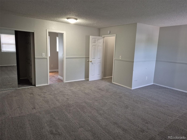 16835 E Harvard Pl, Aurora, CO 80013 - unfurnished bedroom with a textured ceiling, carpet flooring, and baseboards