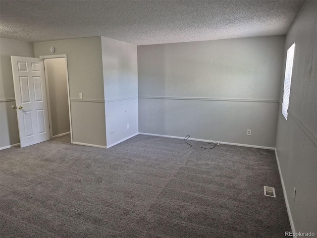 16835 E Harvard Pl, Aurora, CO 80013 - carpeted spare room featuring a textured ceiling and baseboards