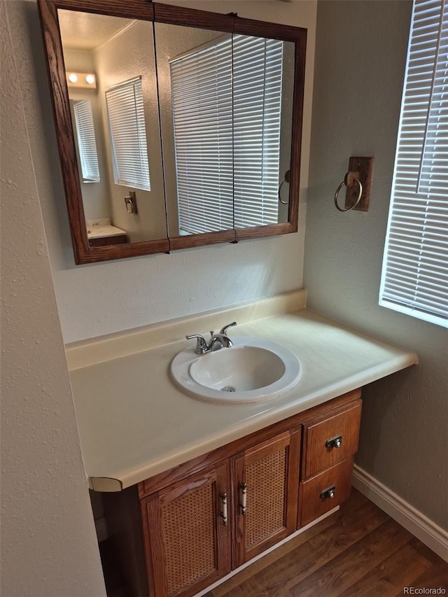16835 E Harvard Pl, Aurora, CO 80013 - bathroom featuring vanity and wood finished floors