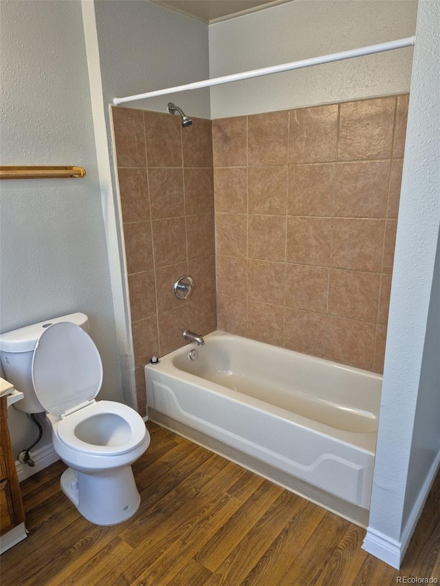 16835 E Harvard Pl, Aurora, CO 80013 - bathroom with toilet, bathtub / shower combination, wood finished floors, and vanity