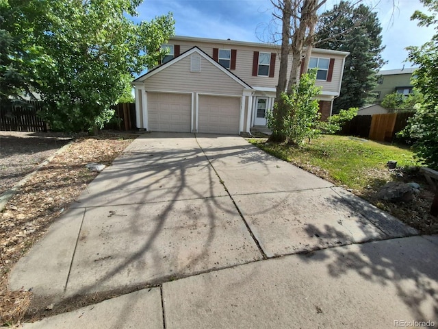 16835 E Harvard Pl, Aurora, CO 80013 - traditional-style house featuring concrete driveway and an attached garage