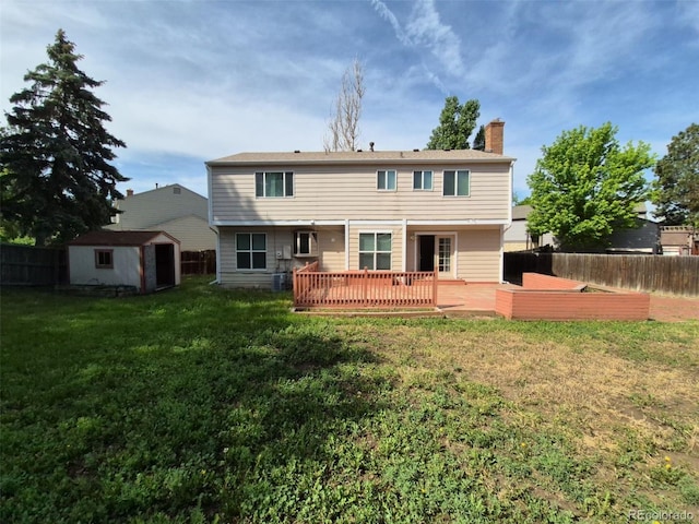 16835 E Harvard Pl, Aurora, CO 80013 - back of property with a chimney and a wooden deck