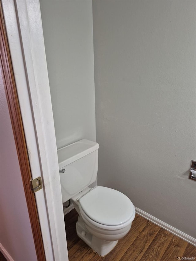 16835 E Harvard Pl, Aurora, CO 80013 - bathroom with baseboards, toilet, and wood finished floors