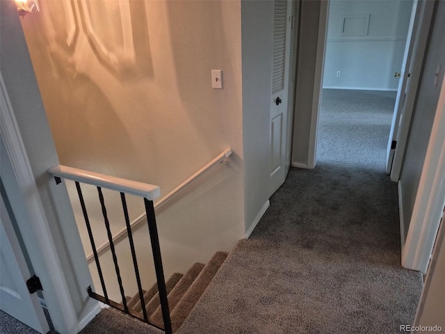 16835 E Harvard Pl, Aurora, CO 80013 - hallway featuring carpet, baseboards, and an upstairs landing
