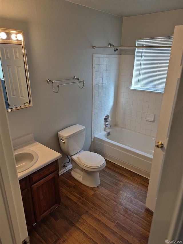 16835 E Harvard Pl, Aurora, CO 80013 - full bathroom featuring vanity,  shower combination, toilet, and wood finished floors