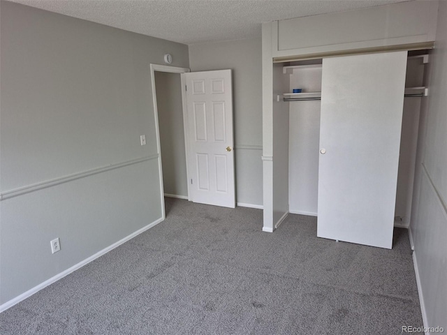 16835 E Harvard Pl, Aurora, CO 80013 - unfurnished bedroom with carpet flooring, a closet, a textured ceiling, and baseboards
