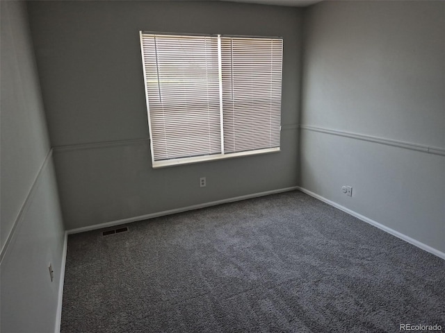 16835 E Harvard Pl, Aurora, CO 80013 - empty room featuring carpet floors and baseboards