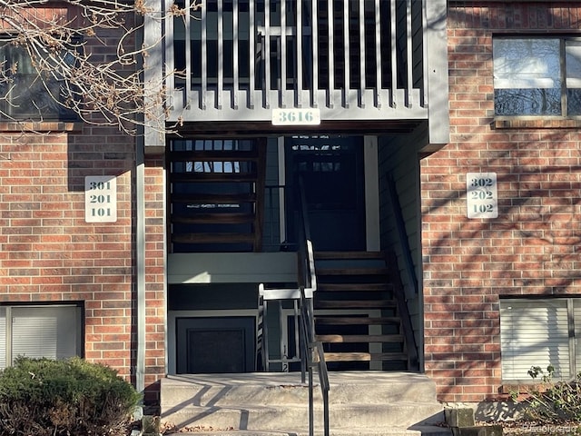 entrance to property featuring a balcony