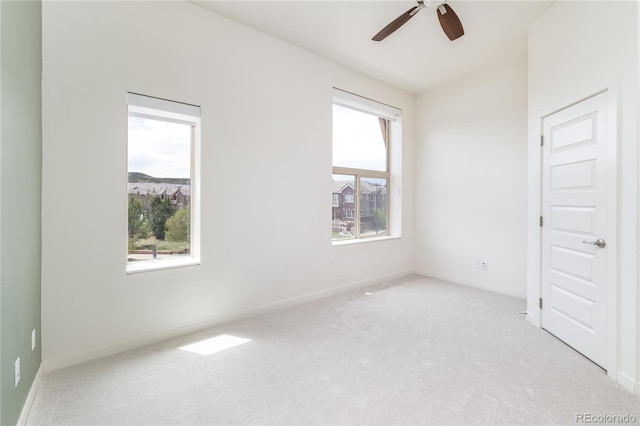 10154 Belvedere Loop, Lone Tree, CO 80124 - unfurnished room with light carpet, ceiling fan, and baseboards