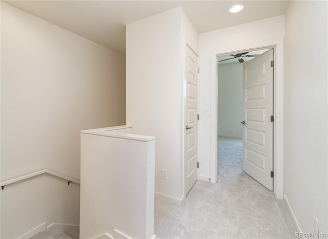 10154 Belvedere Loop, Lone Tree, CO 80124 - hallway featuring an upstairs landing, light carpet, recessed lighting, and baseboards