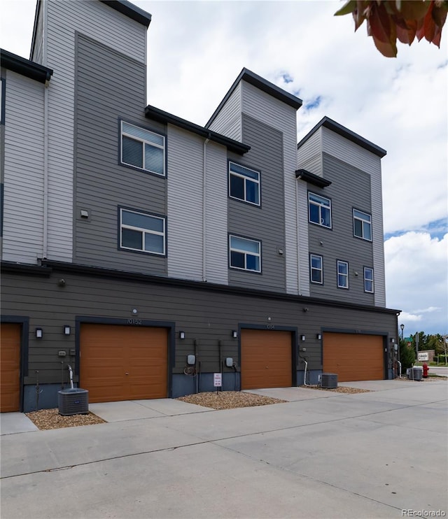 10154 Belvedere Loop, Lone Tree, CO 80124 - view of property with an attached garage, central air condition unit, and concrete driveway