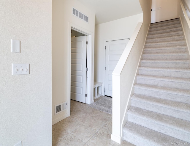 10154 Belvedere Loop, Lone Tree, CO 80124 - stairway featuring tile patterned flooring and baseboards