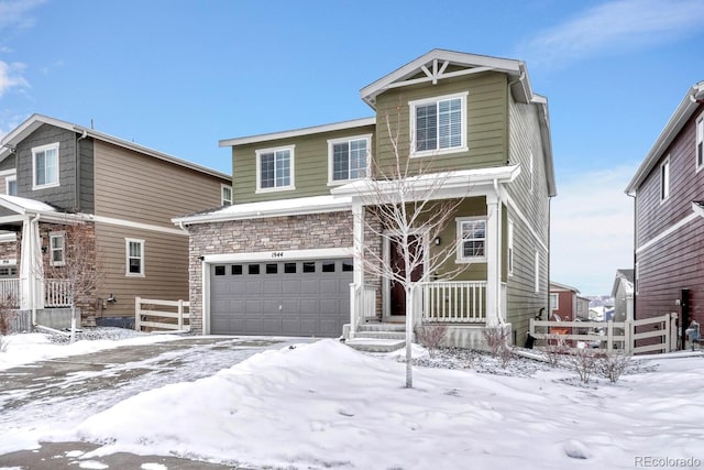 view of front of property featuring a garage and a porch