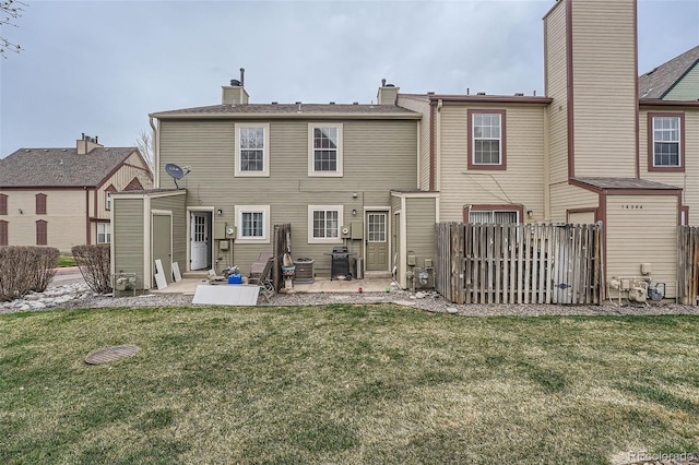 back of property with a patio area, a chimney, and central AC unit