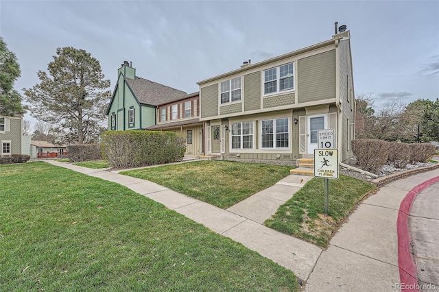 view of property with a front lawn