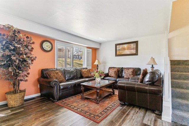 living area featuring stairs, wood finished floors, and baseboards