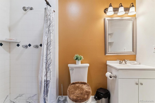 bathroom with toilet, vanity, and a tile shower