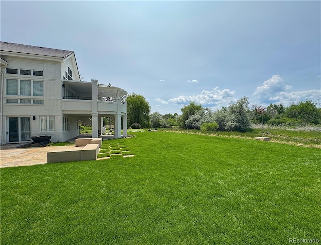 4935 E Preserve Ln, Greenwood Village, CO 80121 - view of green lawn featuring a patio area and a balcony
