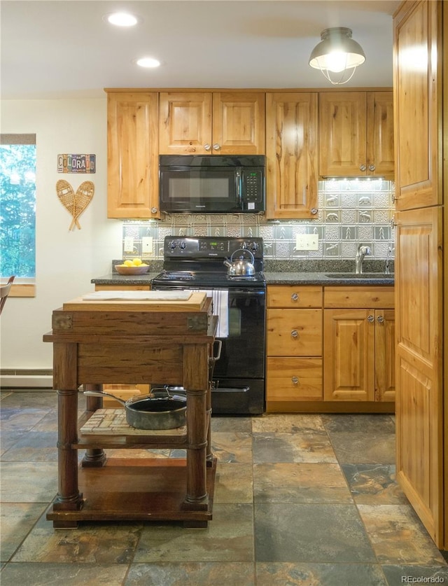 kitchen featuring baseboard heating, sink, decorative backsplash, and black appliances