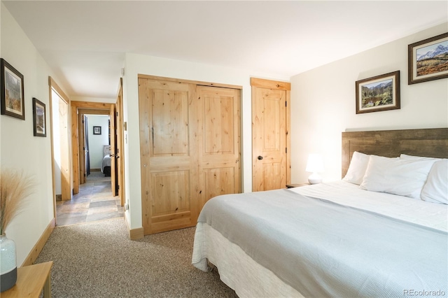 carpeted bedroom featuring a closet