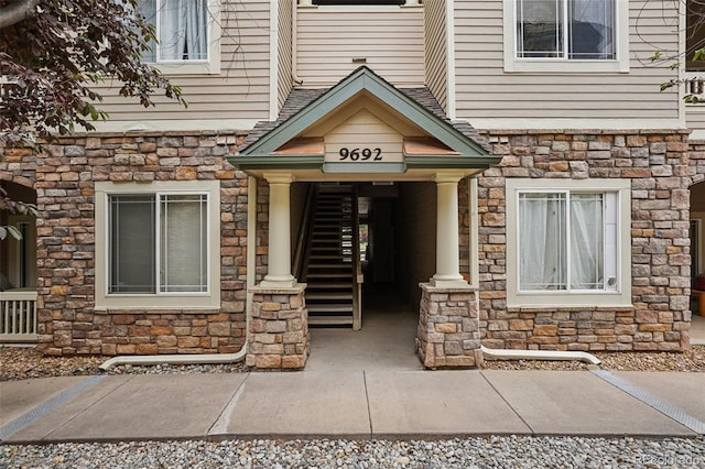 9692 W Coco Cir Unit 304, Littleton, CO 80128 - doorway to property with stone siding