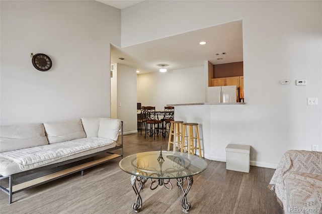 9692 W Coco Cir Unit 304, Littleton, CO 80128 - living area featuring wood finished floors, baseboards, and recessed lighting