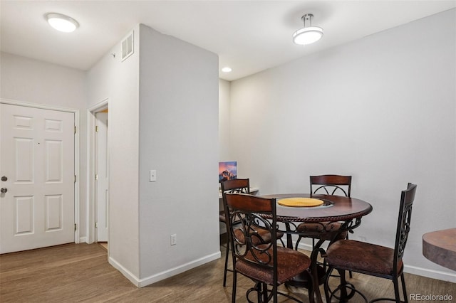 9692 W Coco Cir Unit 304, Littleton, CO 80128 - dining area featuring baseboards and wood finished floors