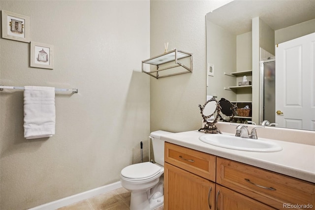 9692 W Coco Cir Unit 304, Littleton, CO 80128 - full bath featuring vanity, a shower stall, toilet, baseboards, and tile patterned flooring