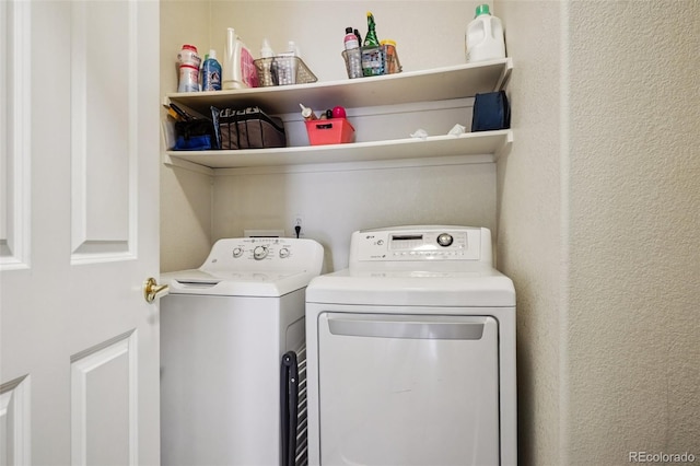 9692 W Coco Cir Unit 304, Littleton, CO 80128 - washroom featuring washing machine and dryer and a textured wall