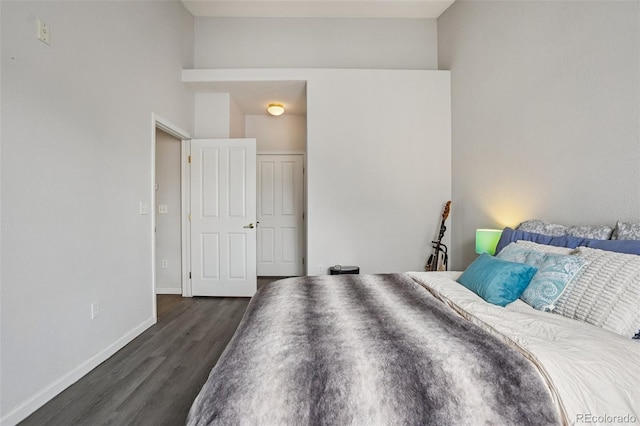 9692 W Coco Cir Unit 304, Littleton, CO 80128 - bedroom with dark wood-type flooring and baseboards