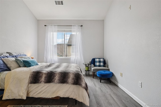 9692 W Coco Cir Unit 304, Littleton, CO 80128 - bedroom featuring baseboards and wood finished floors