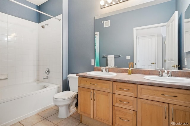9692 W Coco Cir Unit 304, Littleton, CO 80128 - bathroom featuring double vanity, shower / bath combination, tile patterned floors, and toilet