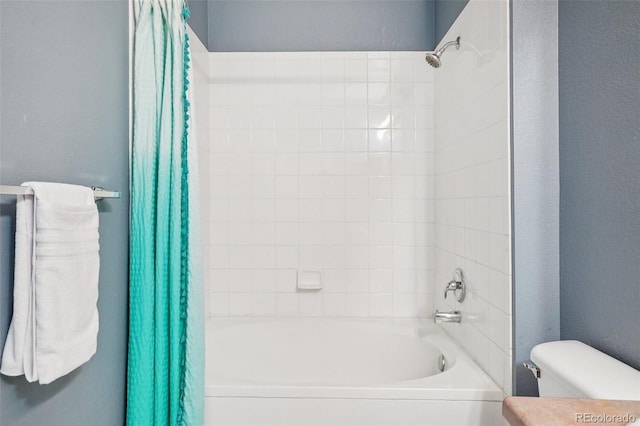 9692 W Coco Cir Unit 304, Littleton, CO 80128 - bathroom featuring shower / bathtub combination with curtain and toilet