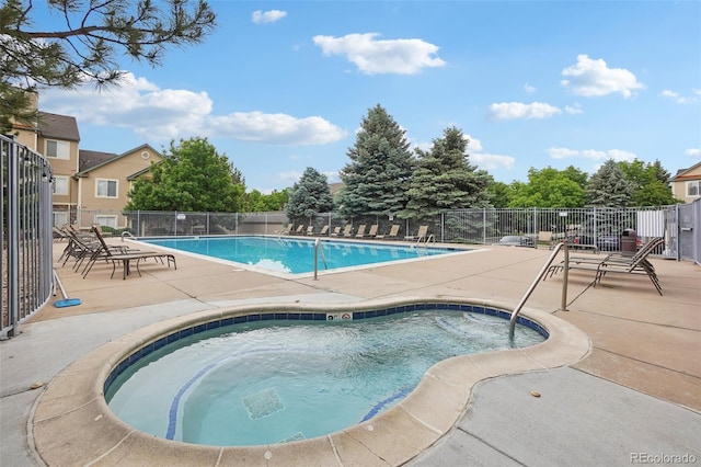9692 W Coco Cir Unit 304, Littleton, CO 80128 - community pool featuring a patio area and a hot tub